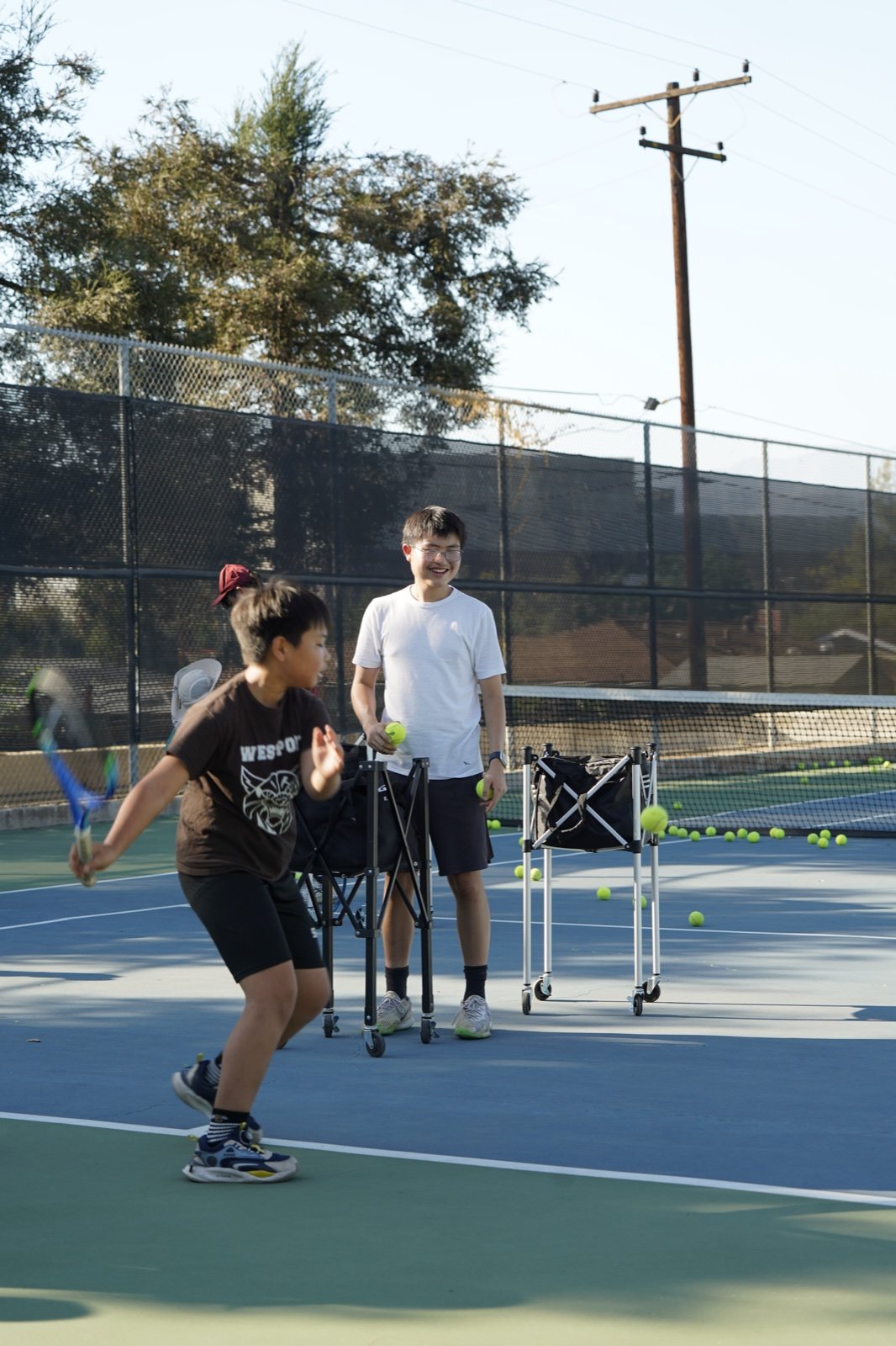 Kids at a Racket Outreach Saturday clinic, Fall 2026